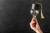 Hand holding educated lightbulb