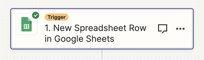 Shows the first trigger step of the Zapier zap as being 'New spreadsheet row in Google Sheets'